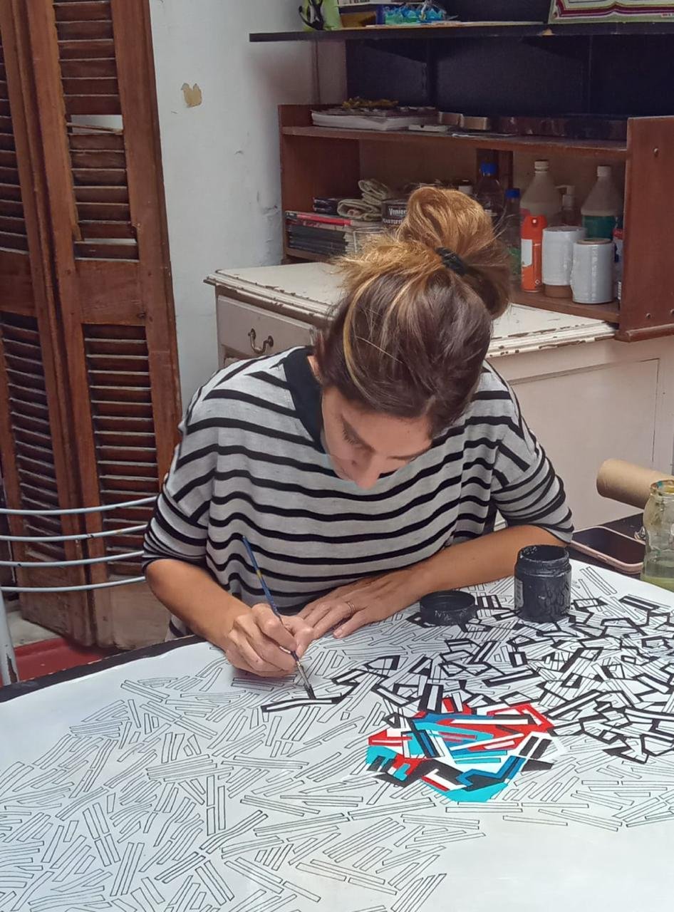 Paola Lettieri painting in her studio.